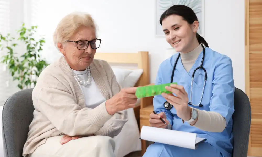Physical therapist helping patient regain mobility during recovery at home