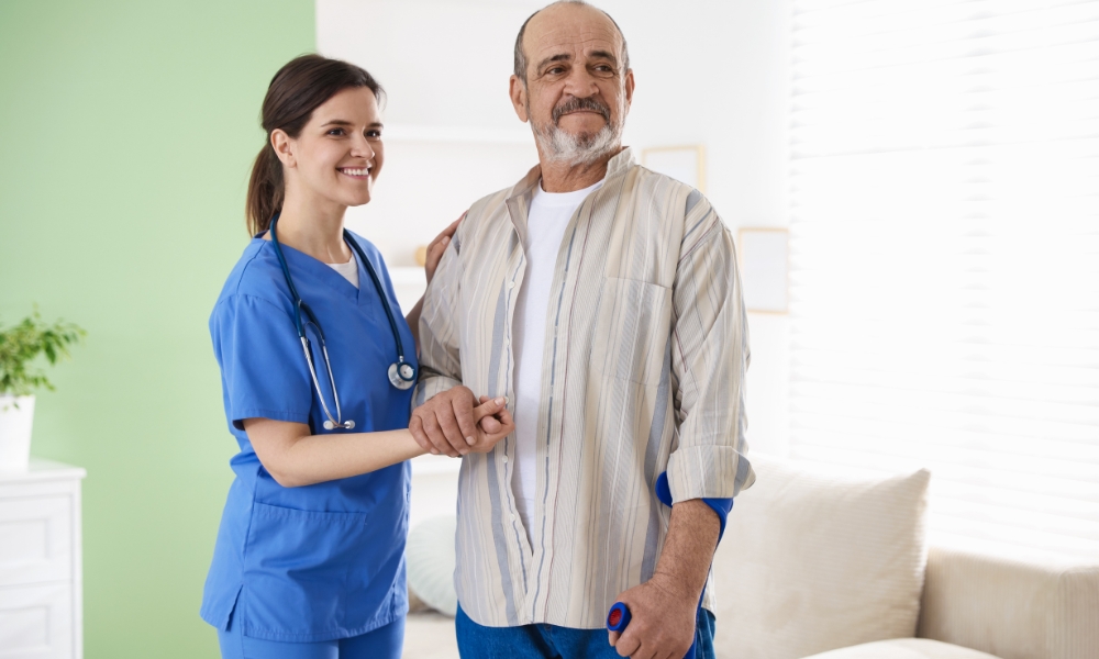 Home health nurse evaluating elderly patient at home for healthcare eligibility