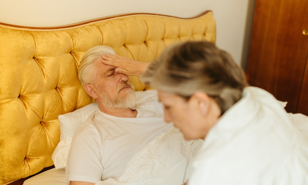 Home health nurse supporting stroke recovery patient at home