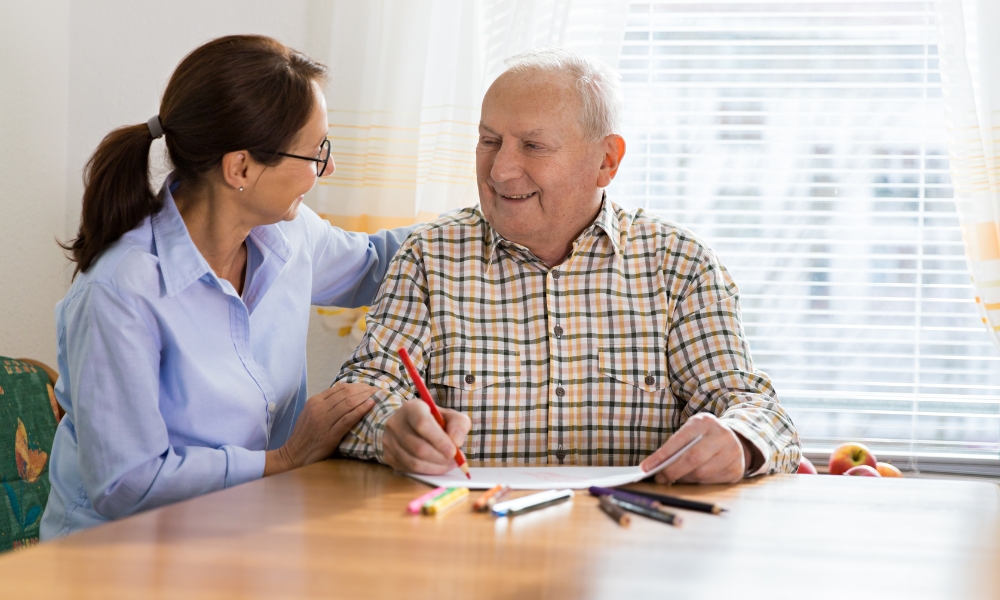 Speech language pathologist helping an elderly patient with swallowing and communication therapy at home