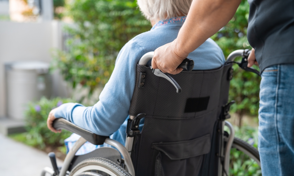 Home health nurse helping senior manage medications safely at home