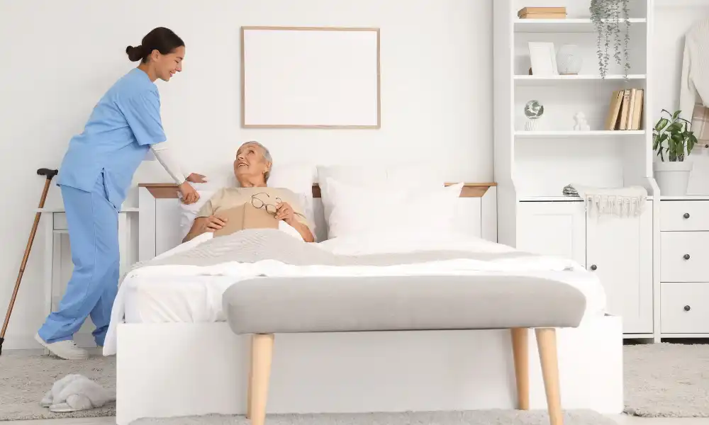 Home health nurse providing wound care and dressing changes for a recovering patient