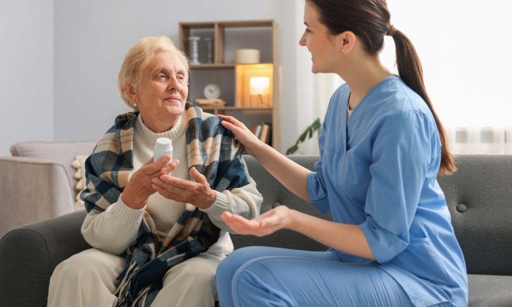 Home health nurse checking vital signs during an in-home nursing visit